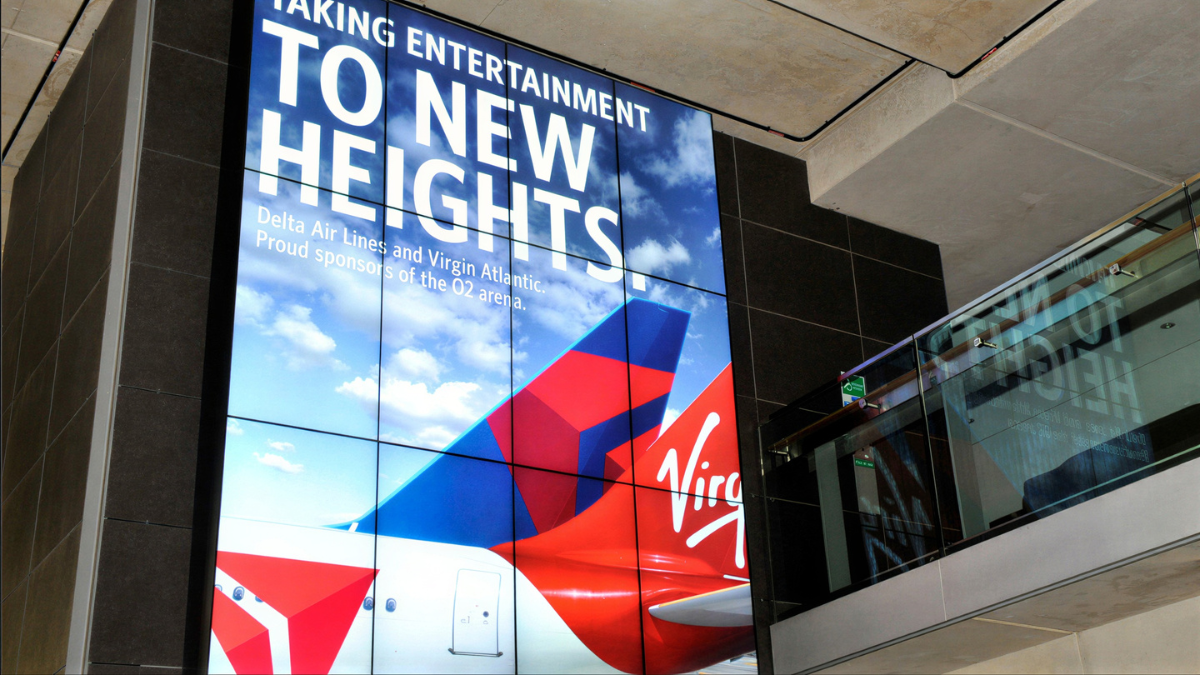 Digital out-of-home video wall display in a transport environment